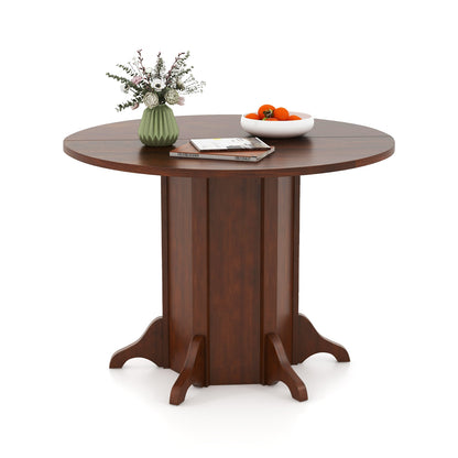 Round Dining Table With Pedestal Base, Walnut, For 4-6 People Dining Tables Walnut at Gallery Canada